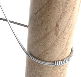 Illustration of wire being shaped on a dowel